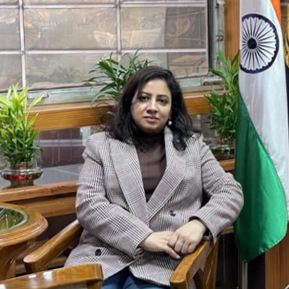 Nidhi Lal - Emotional Well-being Expert Smiling in Calming Setting